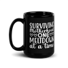 Surviving Motherhood One Meltdown At A Time Black Glossy Mug